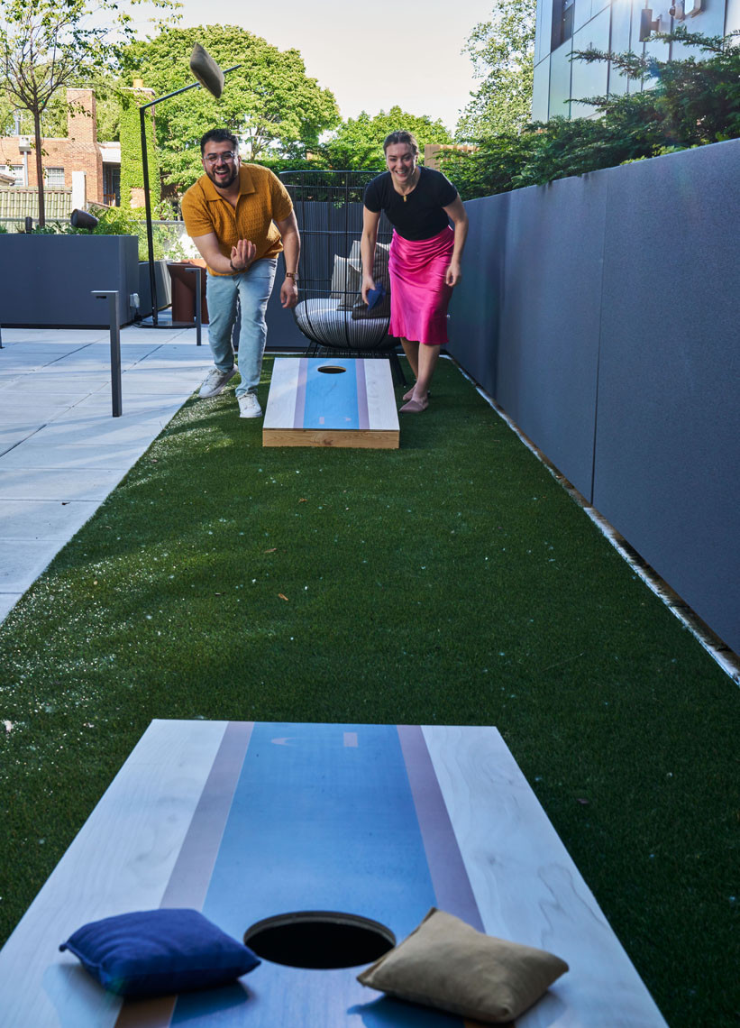 Play a game of cornhole for some friendly competition