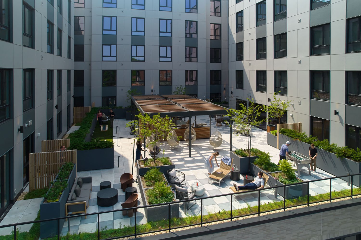 Outdoor terrace with seating, grills and firepit