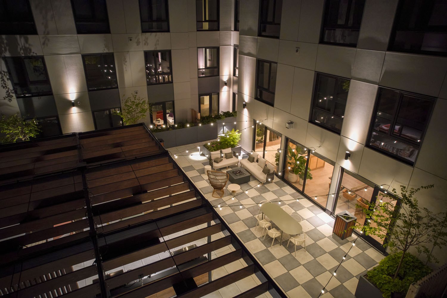 Outdoor terrace lit by string lights