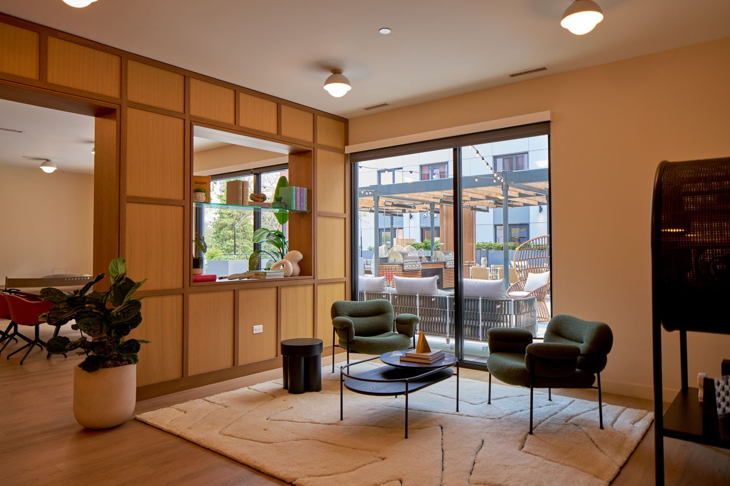 Lounge and game room looking out to the outdoor terrace