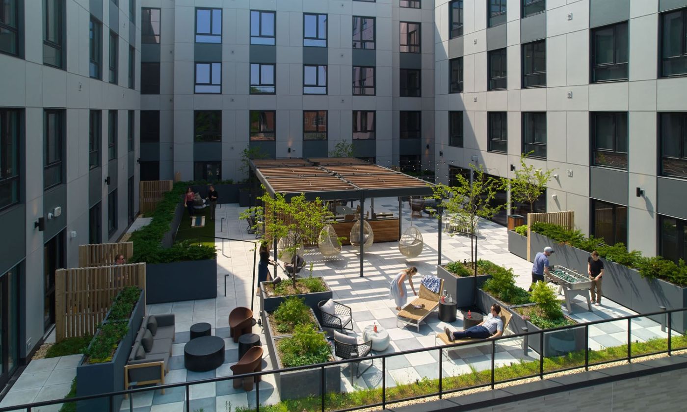 Outdoor terrace with seating, grills and firepit